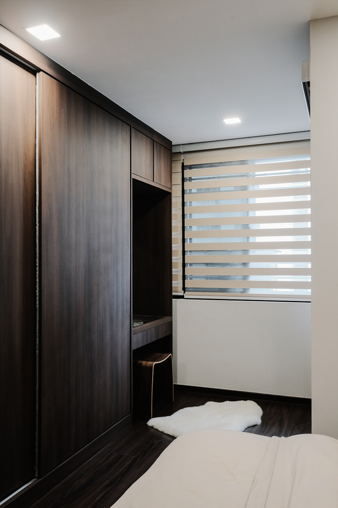 wardrobe, dark furniture, white rug